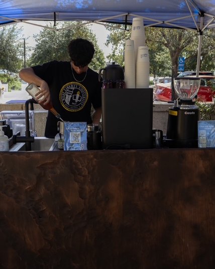 MAWA barista pouring latte art