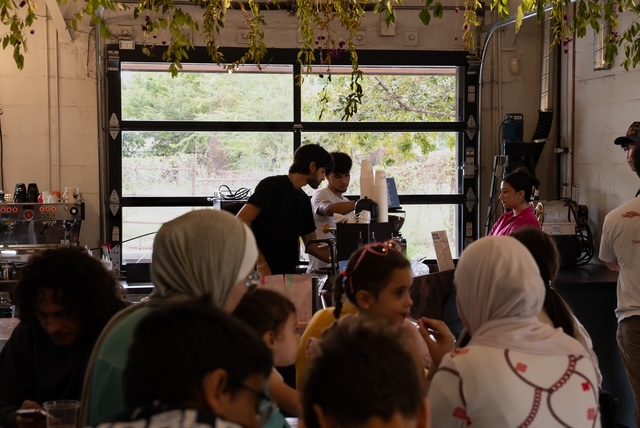 Guests enjoying drinks as MAWA baristas serve at a private party in San Antonio
